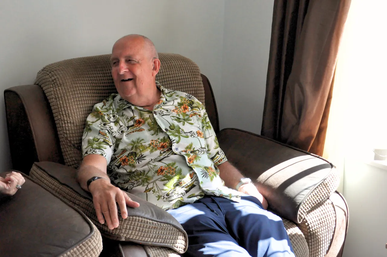 An older man relaxing comfortably and confidently in a recliner at home